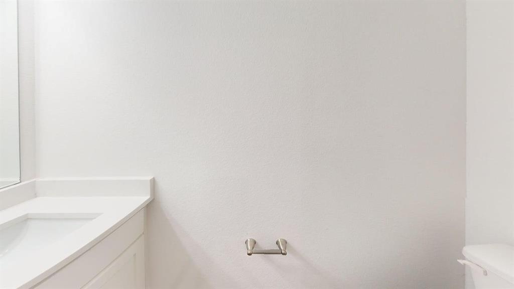 285 Buck Ridge Drive Frisco, TX 75068 - Photo 19 of 20 Bathroom featuring vanity and toilet