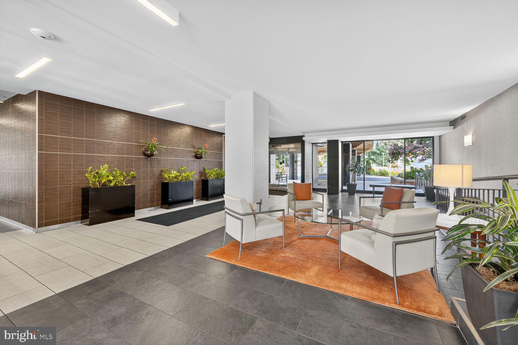 2939 Van Ness Street Northwest, Unit 727 Washington, DC 20008 - Photo 19 of 31 a living room with furniture and a table
