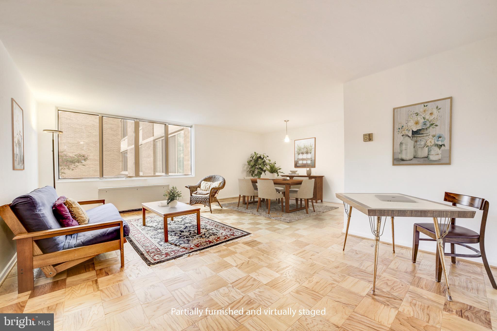 2939 Van Ness Street Northwest, Unit 727 Washington, DC 20008 - Photo 2 of 31 a living room with furniture and a window