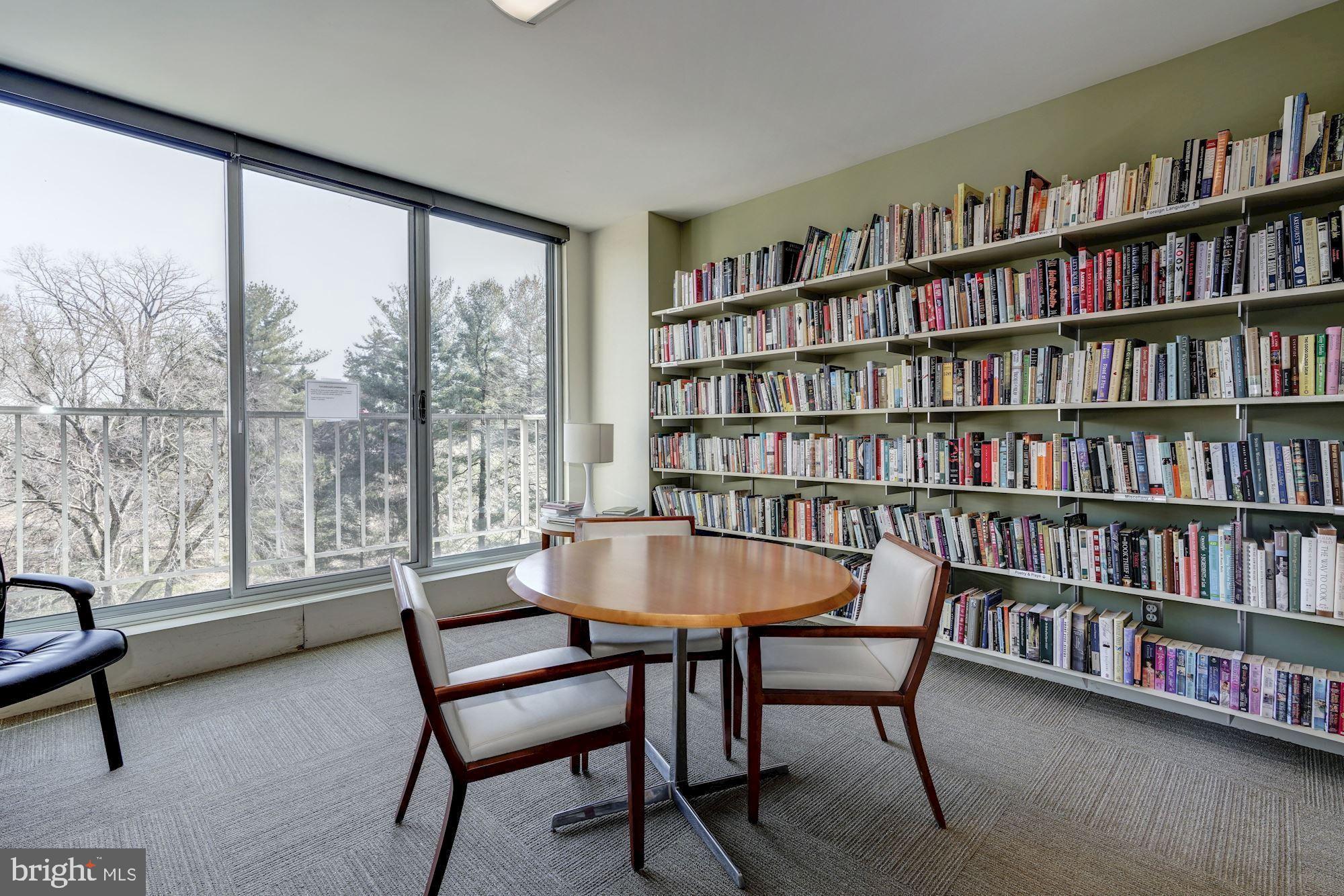 2939 Van Ness Street Northwest, Unit 727 Washington, DC 20008 - Photo 22 of 31 a reading room with furniture and a book shelf