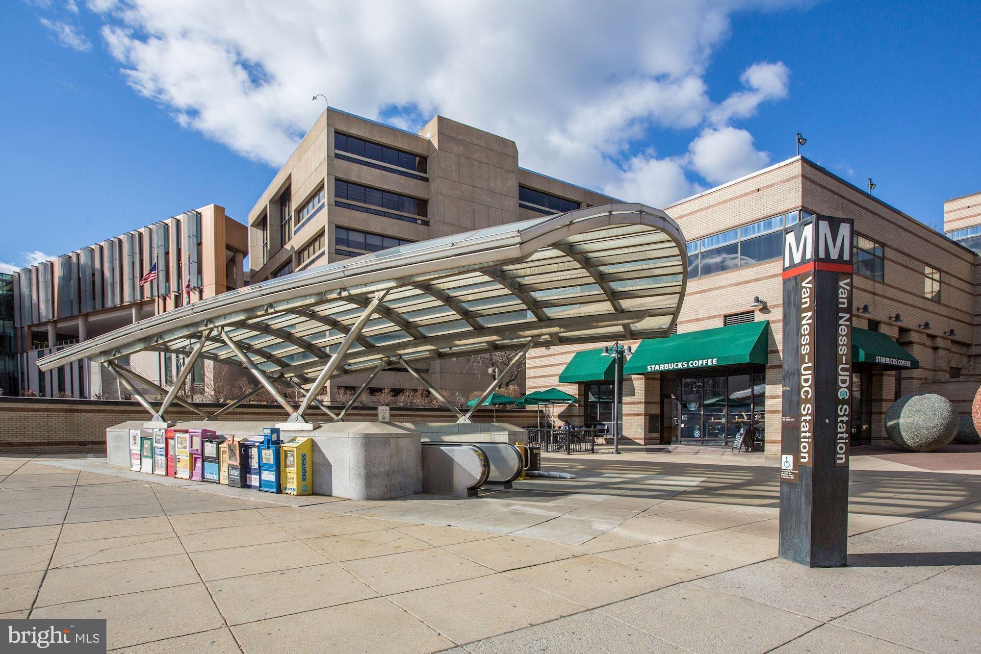 2939 Van Ness Street Northwest, Unit 727 Washington, DC 20008 - Photo 28 of 31 a view of building along with the road and shops