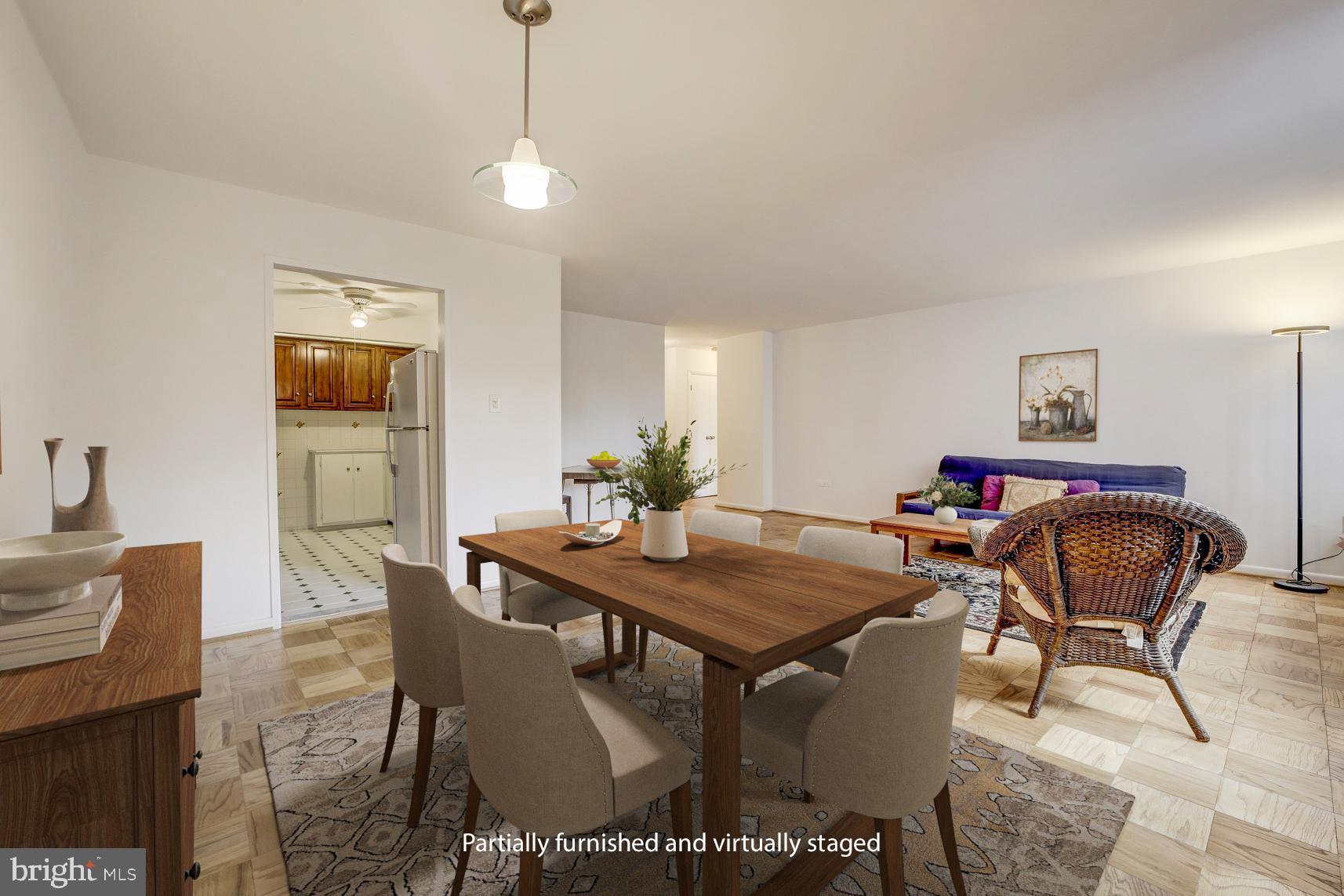 2939 Van Ness Street Northwest, Unit 727 Washington, DC 20008 - Photo 4 of 31 a view of a dining room with furniture