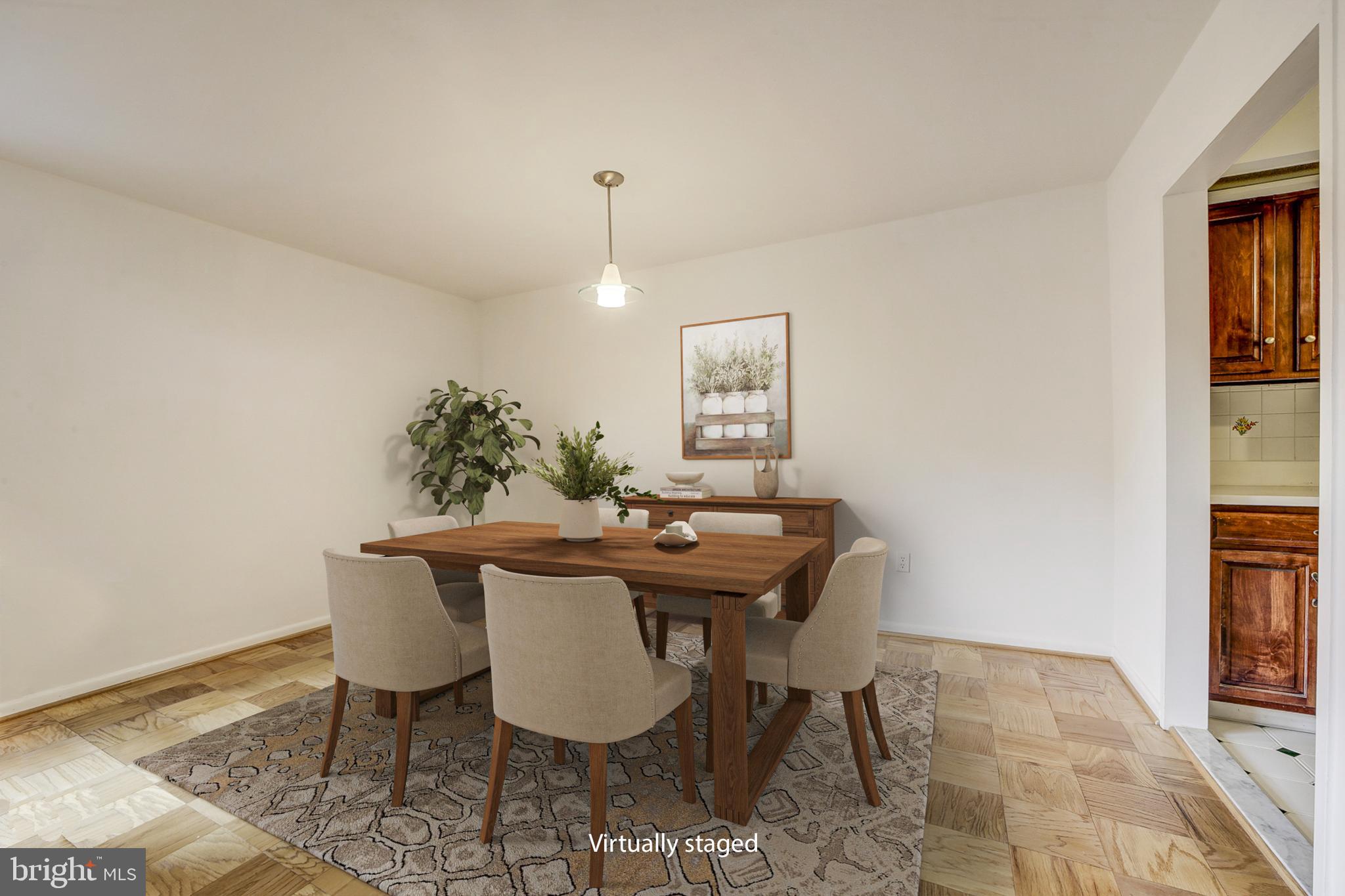 2939 Van Ness Street Northwest, Unit 727 Washington, DC 20008 - Photo 7 of 31 a view of a dining room with furniture and window