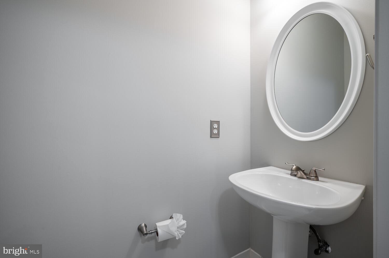 12024 Taliesin Place, Unit 33 Reston, VA 20190 - Photo 13 of 32 a bathroom with a sink and a mirror