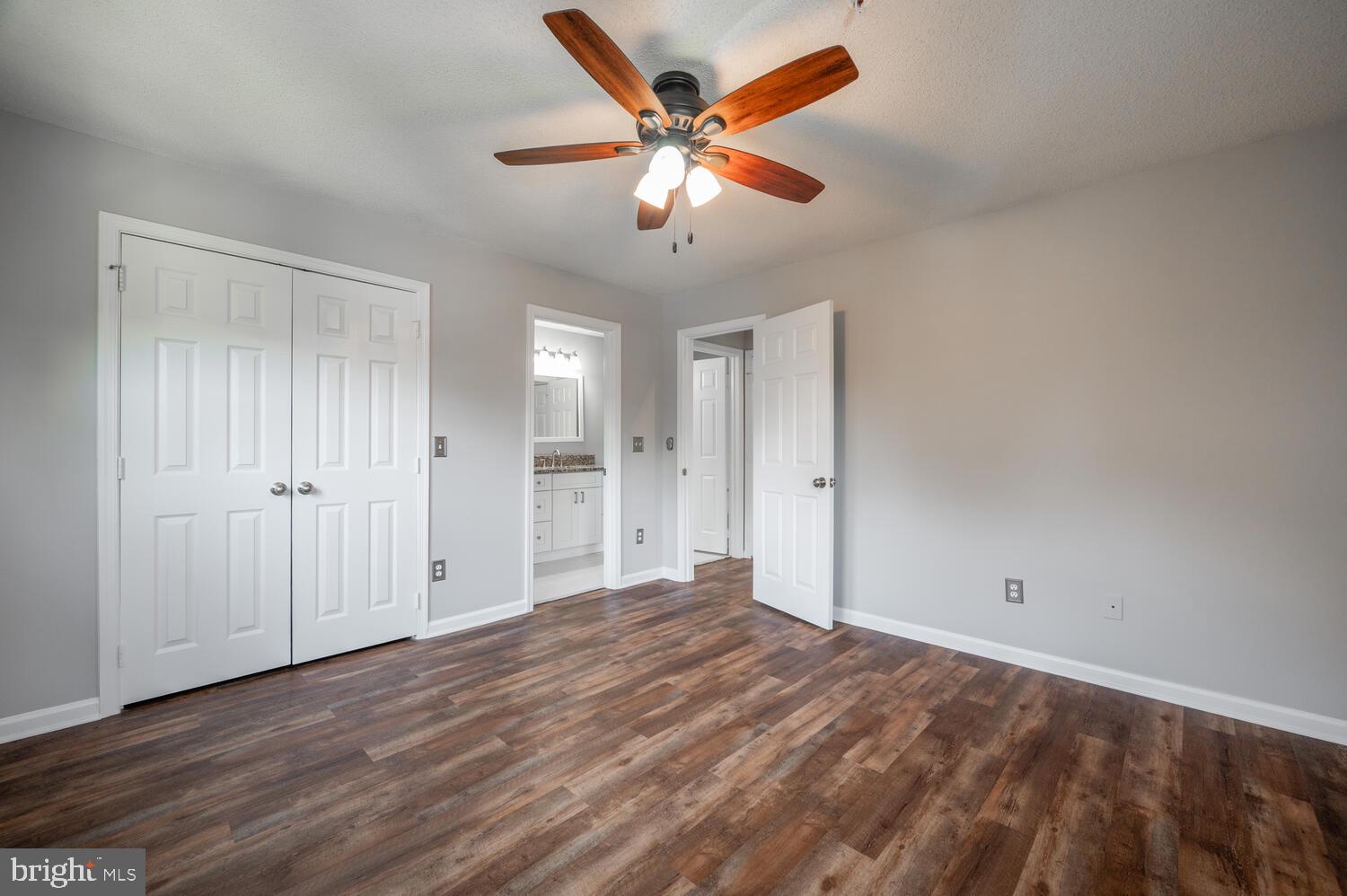 12024 Taliesin Place, Unit 33 Reston, VA 20190 - Photo 19 of 32 a view of an empty room with cabinet and a ceiling fan