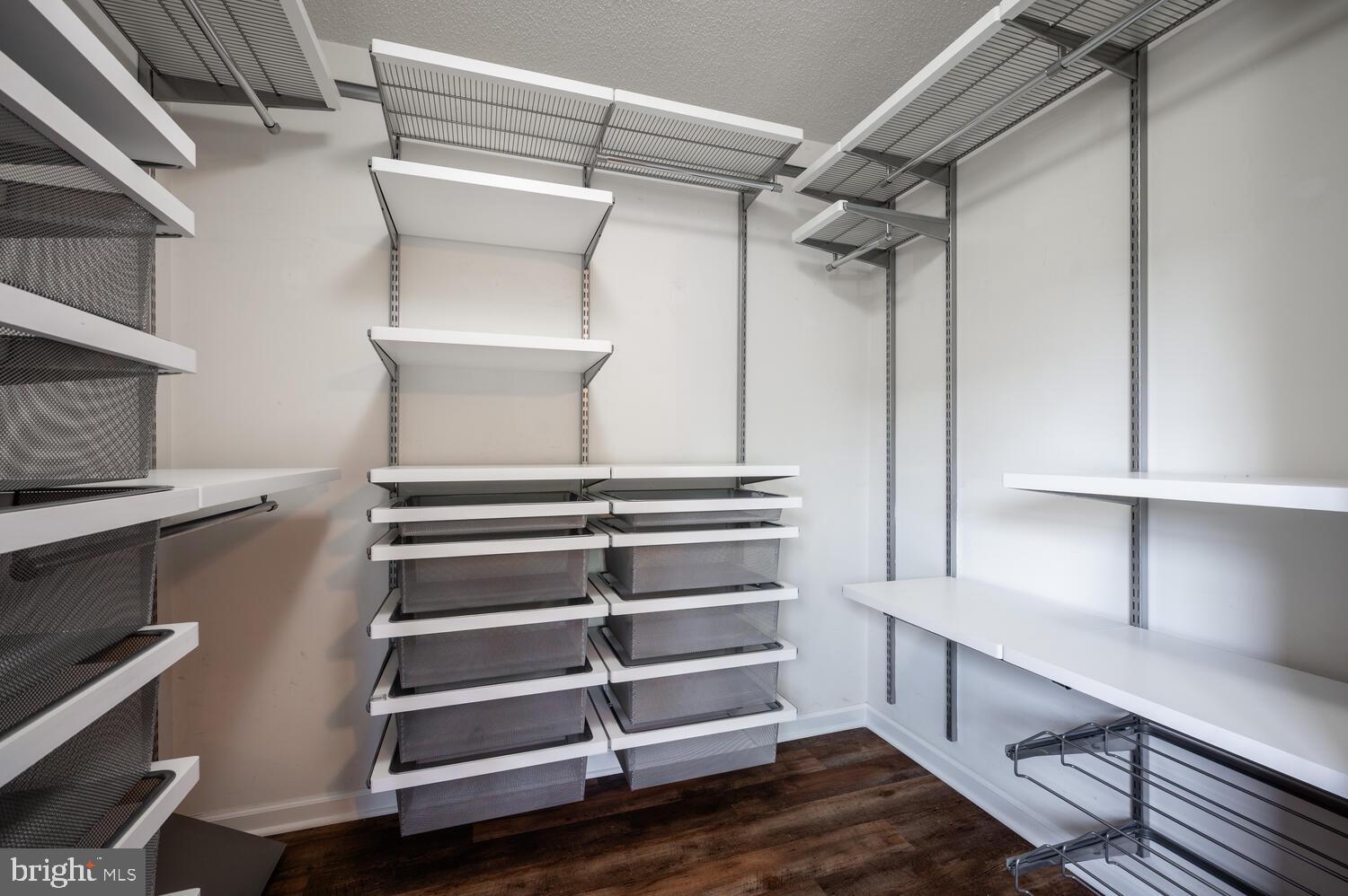 12024 Taliesin Place, Unit 33 Reston, VA 20190 - Photo 21 of 32 a view of walk in closet with empty racks