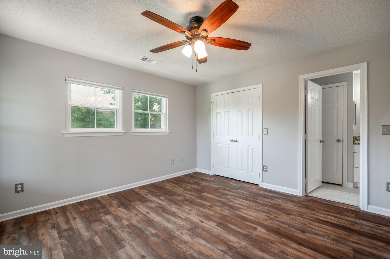 12024 Taliesin Place, Unit 33 Reston, VA 20190 - Photo 22 of 32 an empty room with fan and windows