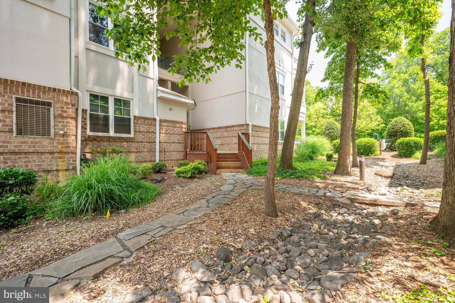 12024 Taliesin Place, Unit 33 Reston, VA 20190 - Photo 32 of 32 a view of a house with a yard and pathway