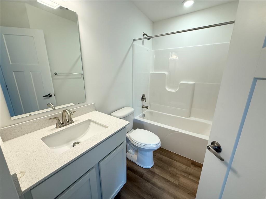 174 Lockheed Drive Coraopolis, PA 15108 - Photo 14 of 15 a bathroom with a sink toilet a mirror and shower