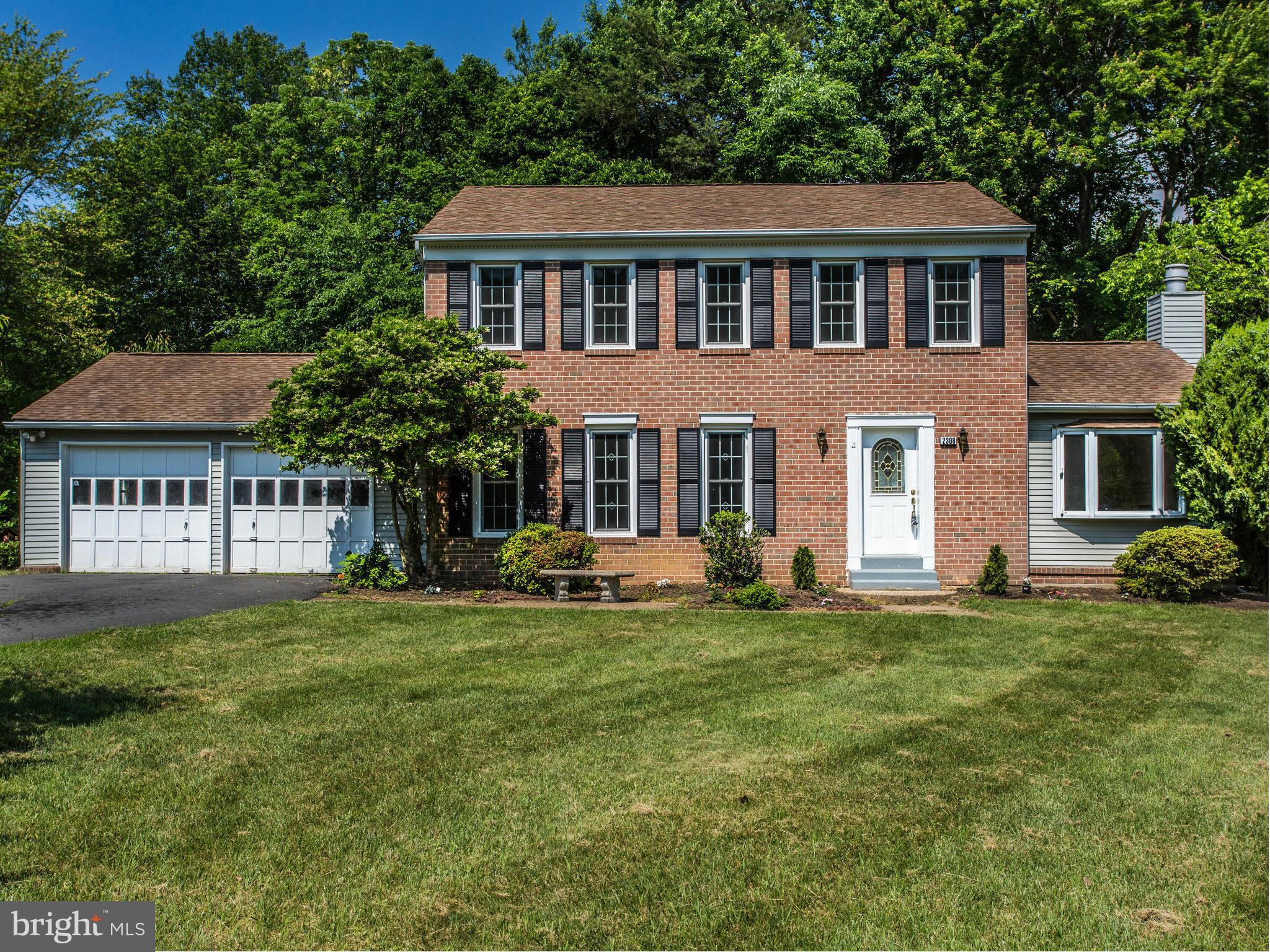 2308 St Bedes Court Reston, VA 20191 - Photo 2 of 30 a front view of a house with a garden
