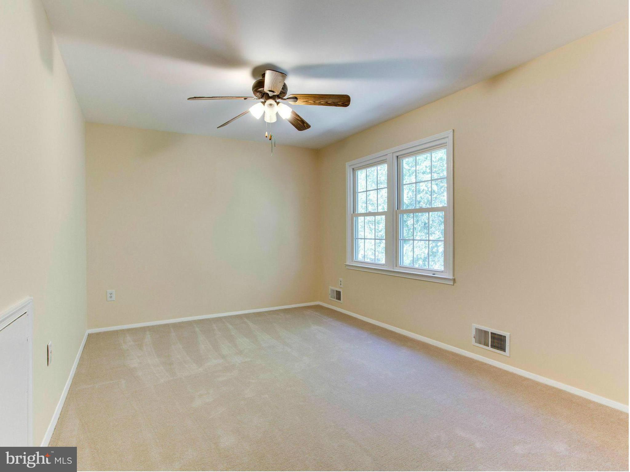 2308 St Bedes Court Reston, VA 20191 - Photo 19 of 30 an empty room with windows and fan