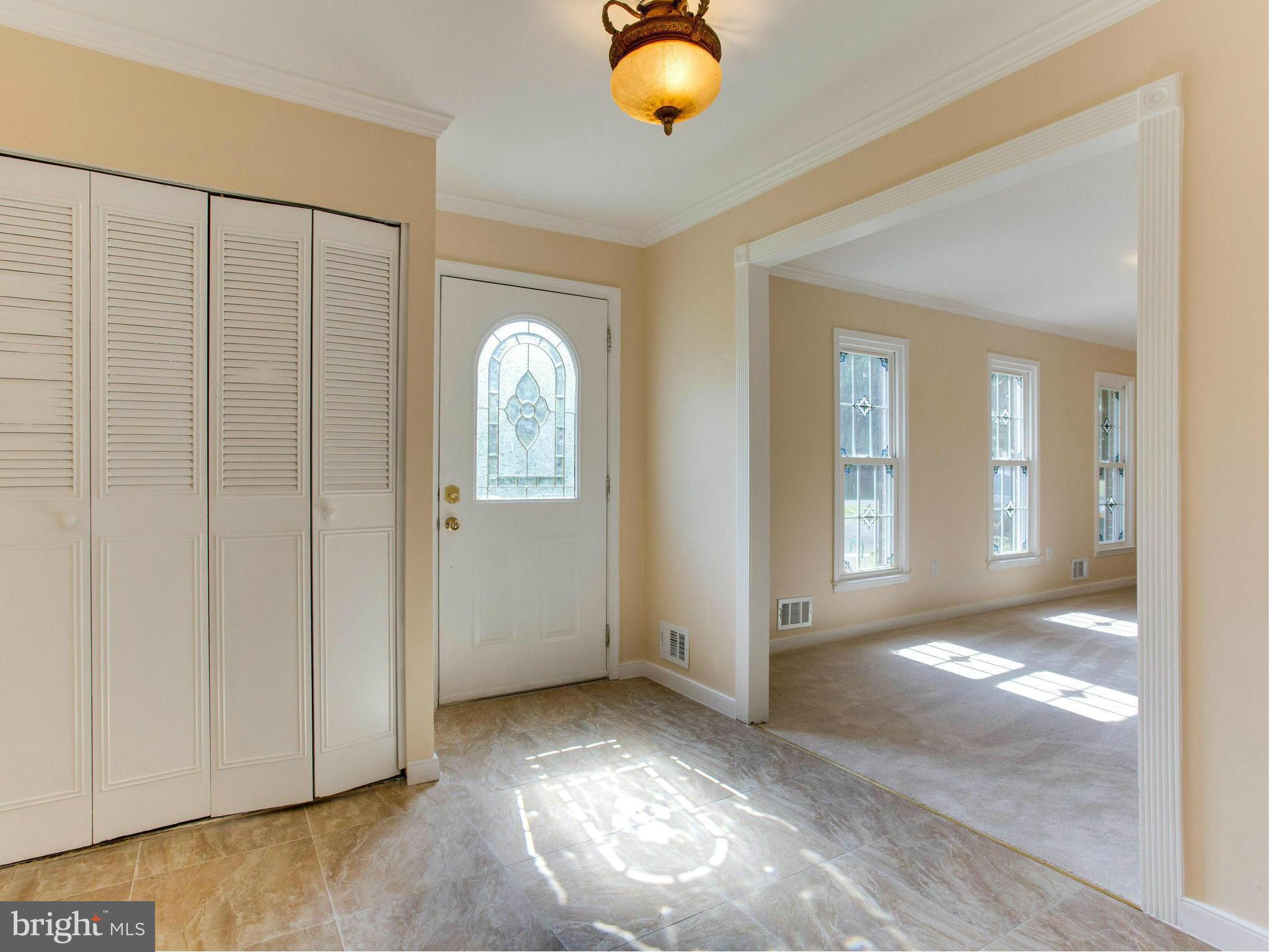 2308 St Bedes Court Reston, VA 20191 - Photo 3 of 30 a view of a livingroom with wooden floor and window