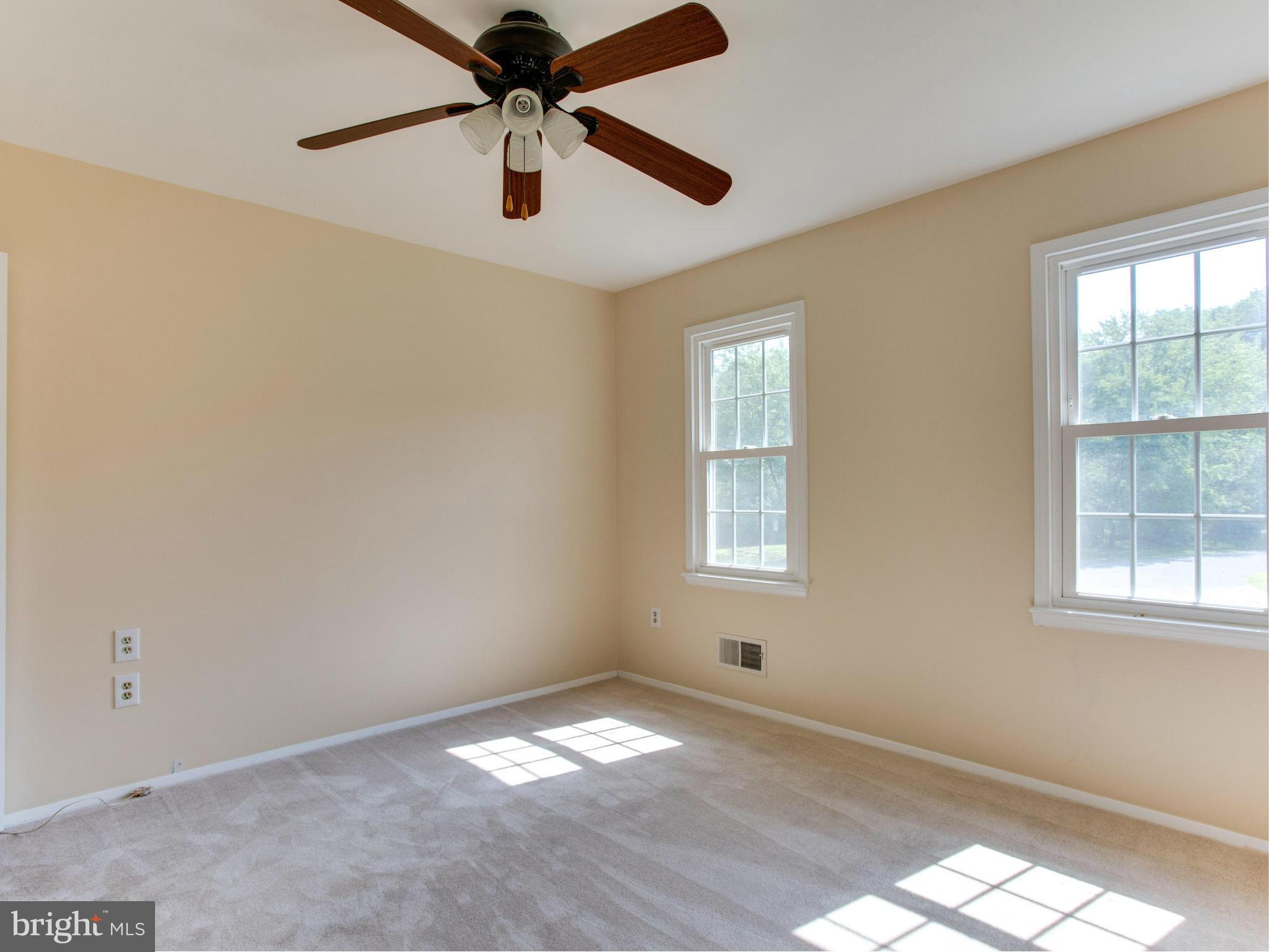 2308 St Bedes Court Reston, VA 20191 - Photo 24 of 30 an empty room with a window and a fan