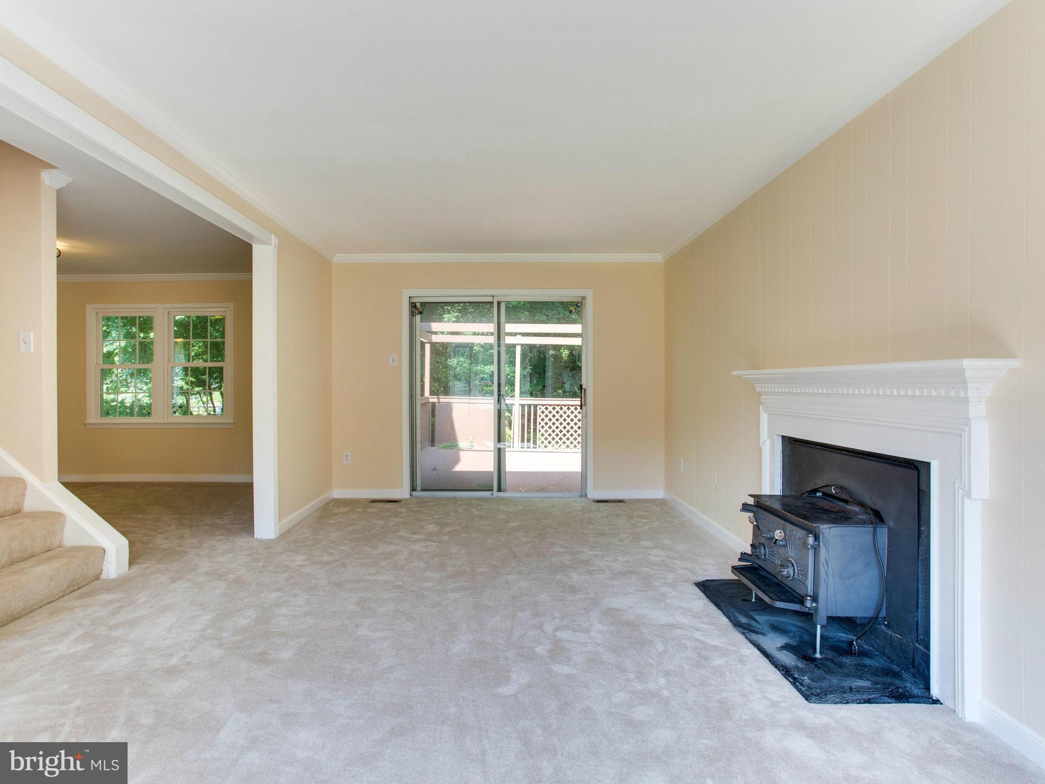 2308 St Bedes Court Reston, VA 20191 - Photo 7 of 30 an empty room with furniture and a fireplace