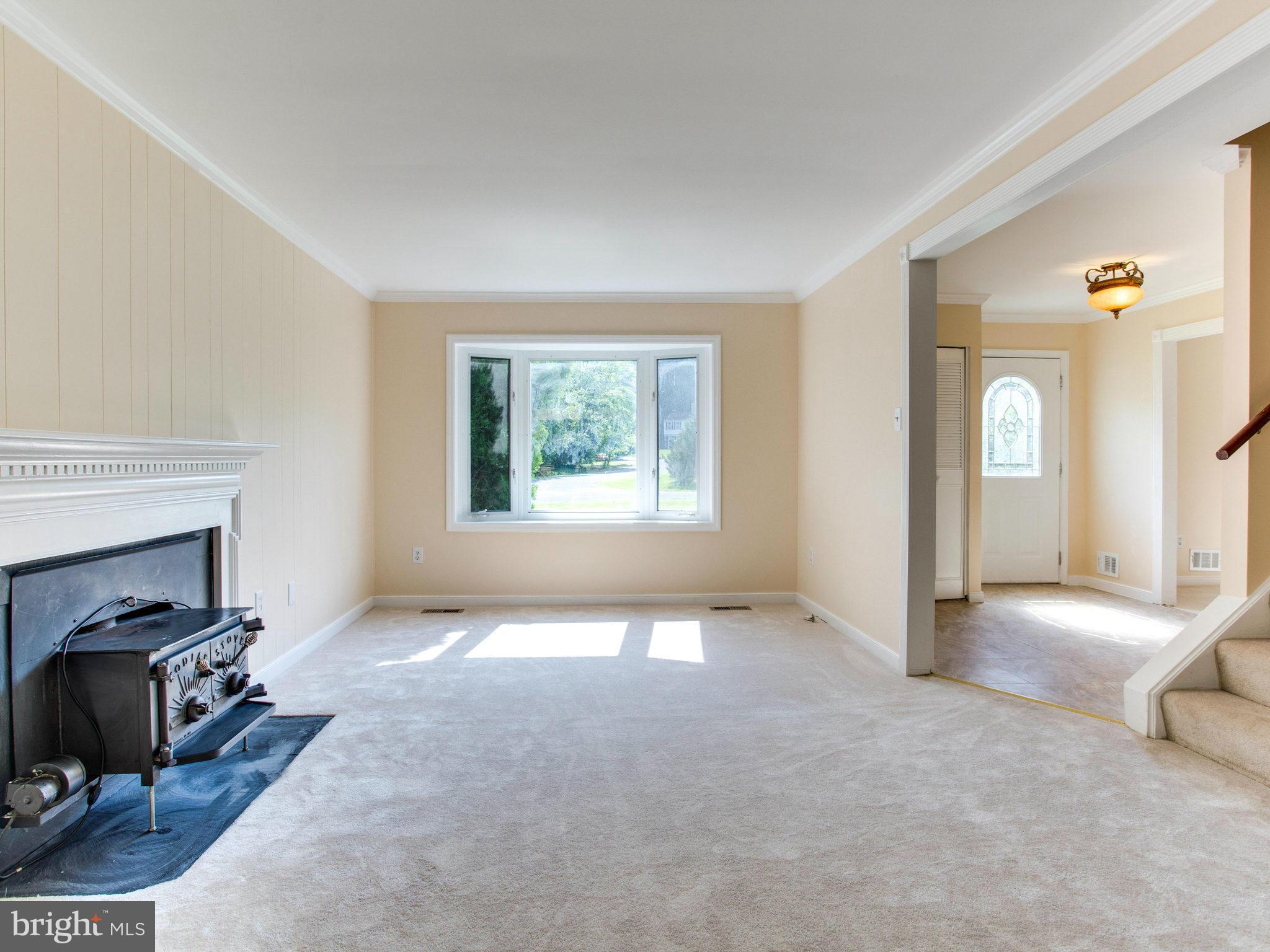 2308 St Bedes Court Reston, VA 20191 - Photo 8 of 30 a view of a livingroom with a fireplace and a window