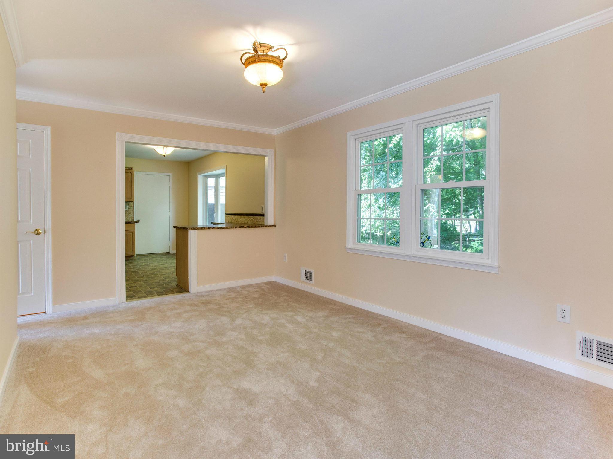2308 St Bedes Court Reston, VA 20191 - Photo 9 of 30 an empty room with windows and wooden floor