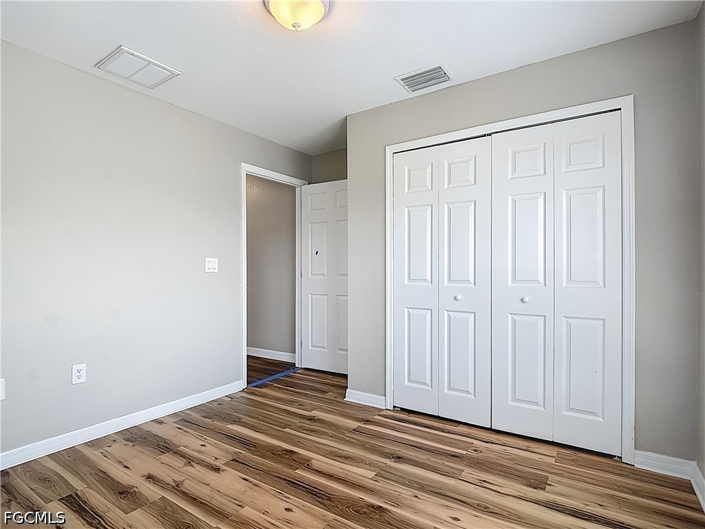 3713 20th Street Southwest Lehigh Acres, FL 33976 - Photo 16 of 23 a view of a livingroom with wooden floor