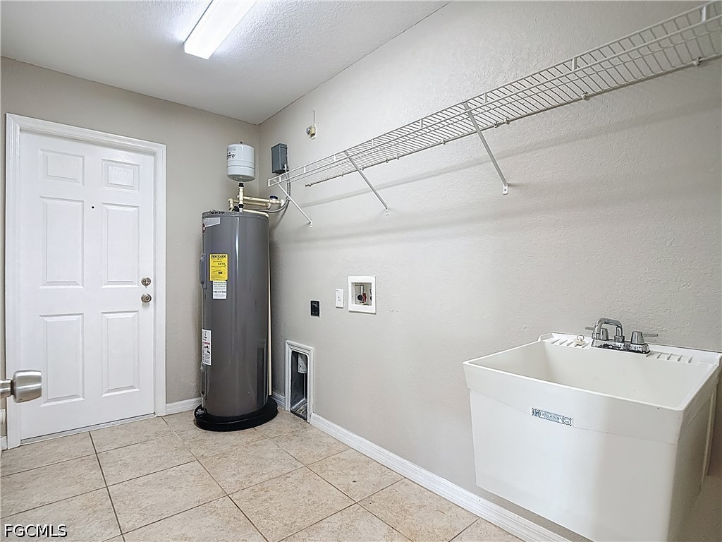 3713 20th Street Southwest Lehigh Acres, FL 33976 - Photo 20 of 23 a view of a utility room with closet dryer and washer