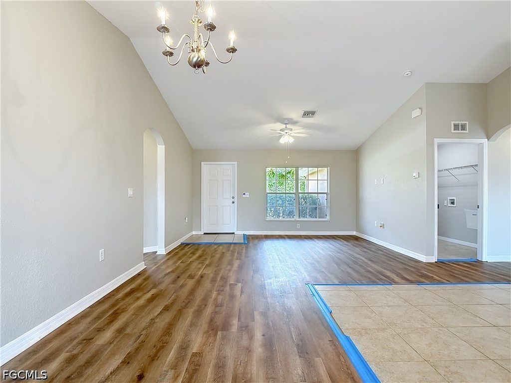 3713 20th Street Southwest Lehigh Acres, FL 33976 - Photo 2 of 23 wooden floor in an empty room with a window