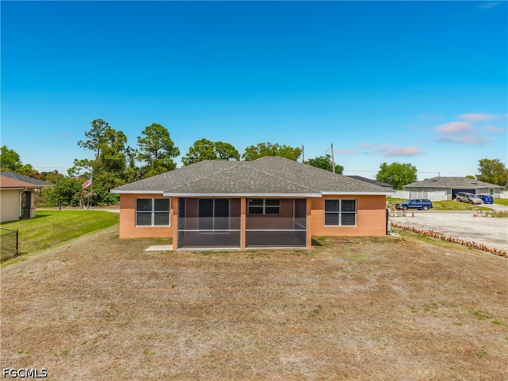 3713 20th Street Southwest Lehigh Acres, FL 33976 - Photo 23 of 23 front view of a house with a yard