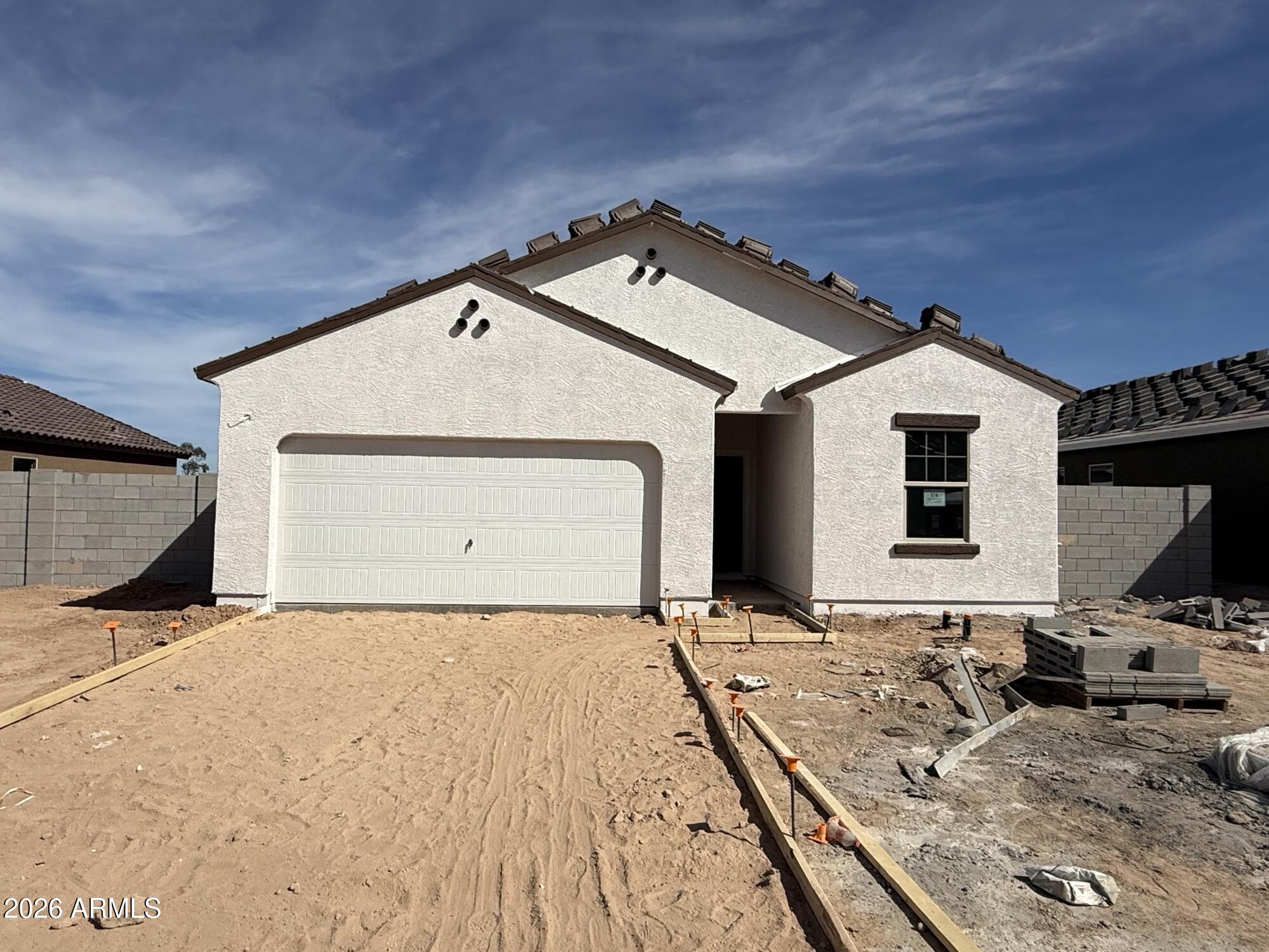 25713 North Poseidon Road Florence, AZ 85132 - Photo 2 of 12 a front view of a house with a yard
