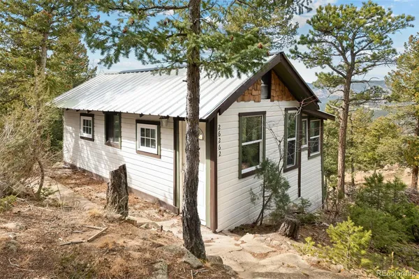 a living room with a large rug next to a large window