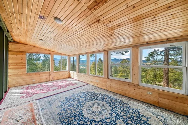 a view of a room with a large window