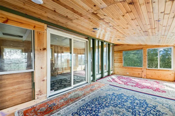 a view of a room with a large window