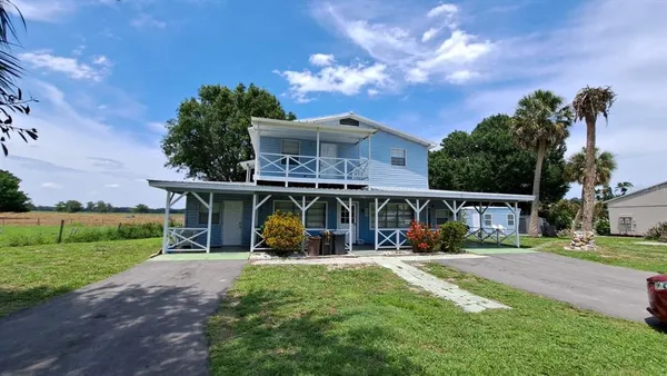 front view of house with outdoor space and porch