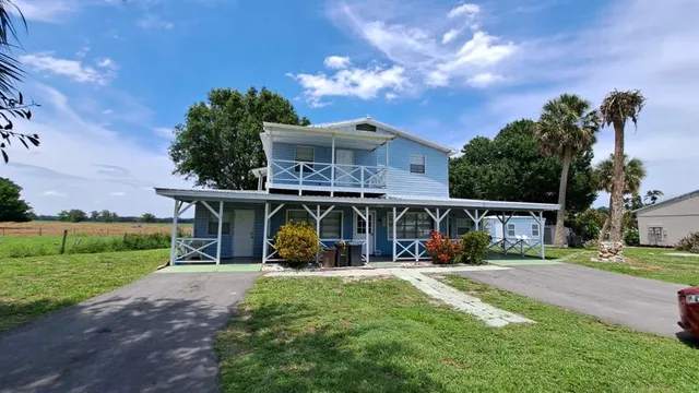 front view of house with outdoor space and porch