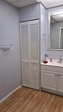 a bathroom with a sink a mirror and a shower
