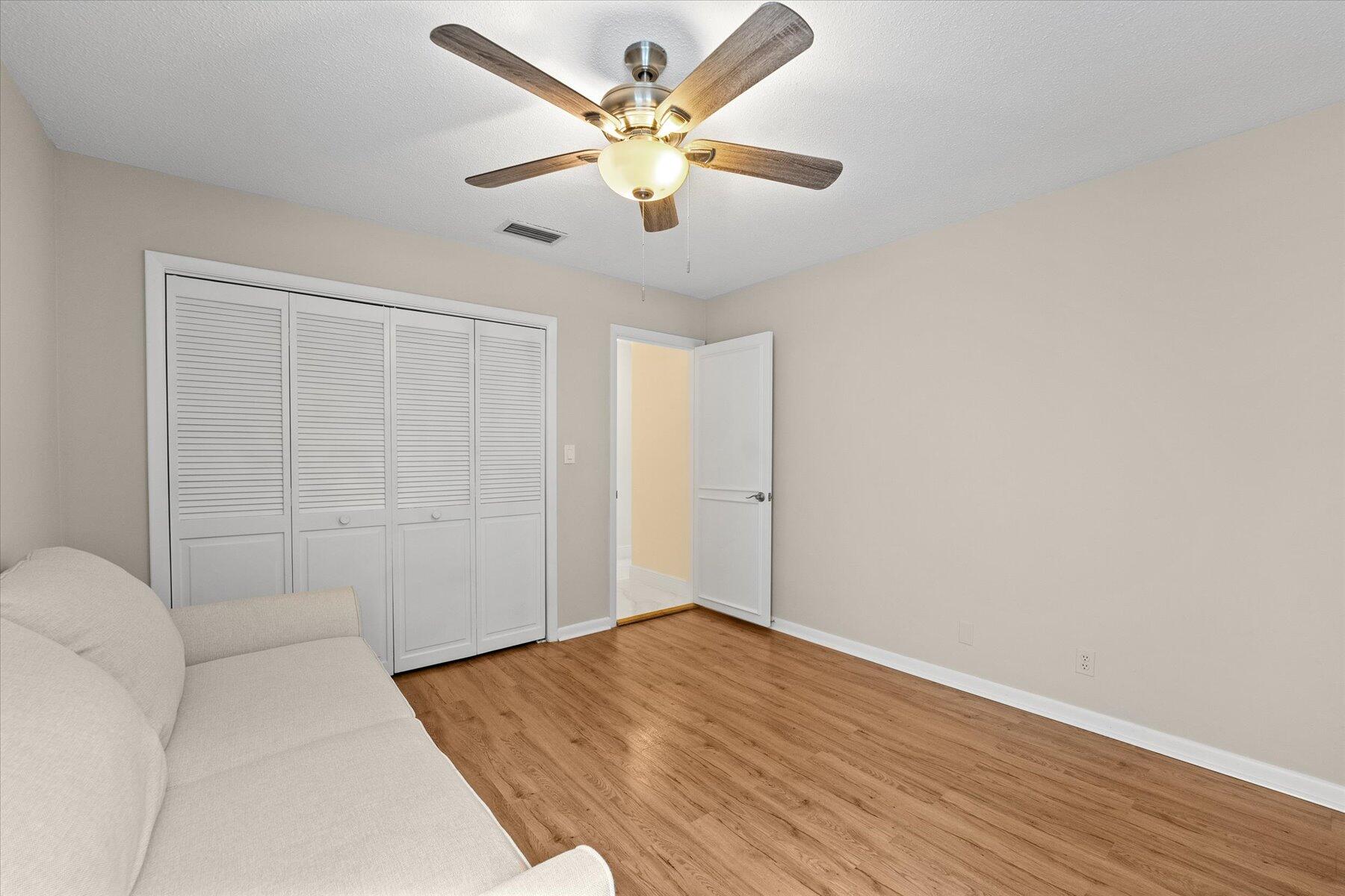 2700 Northwest 41st Street Boca Raton, FL 33434 - Photo 54 of 89 wooden floor in an empty room with a window