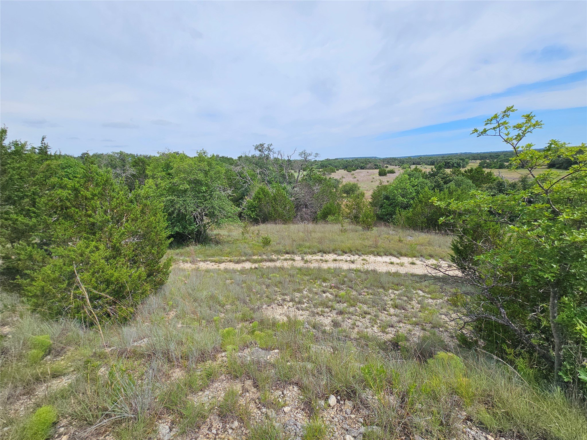 580 East 0123 Kempner, TX 76539 - Photo 5 of 15 An untouched, expansive landscape awaits new construction amidst rugged terrain.