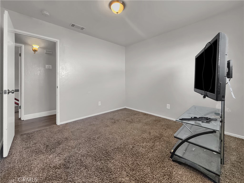 2846 North Parsons Merced, CA 95340 - Photo 12 of 29 a living room with furniture and a flat screen tv