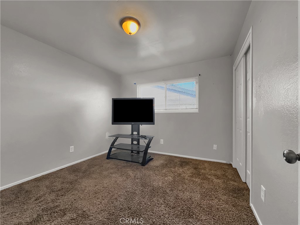 2846 North Parsons Merced, CA 95340 - Photo 13 of 29 a living room with furniture and a flat screen tv