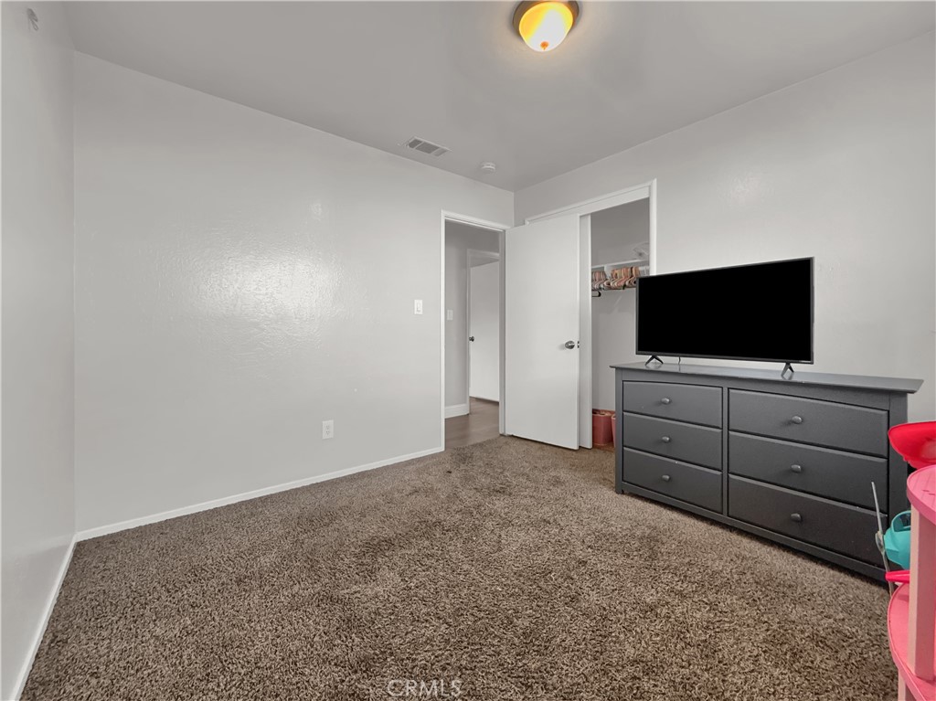 2846 North Parsons Merced, CA 95340 - Photo 18 of 29 a view of room with cabinet and flat screen tv