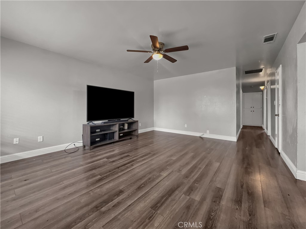 2846 North Parsons Merced, CA 95340 - Photo 22 of 29 wooden floor in living room with a flat screen tv