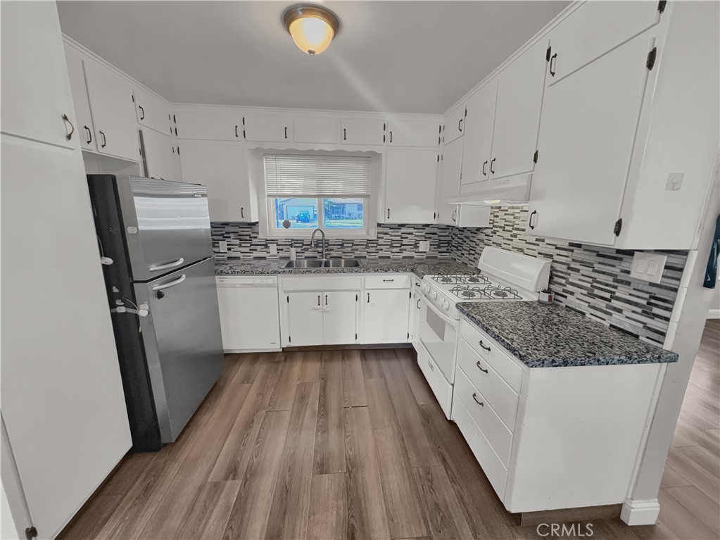 2846 North Parsons Merced, CA 95340 - Photo 10 of 29 a kitchen with sink stove and cabinets