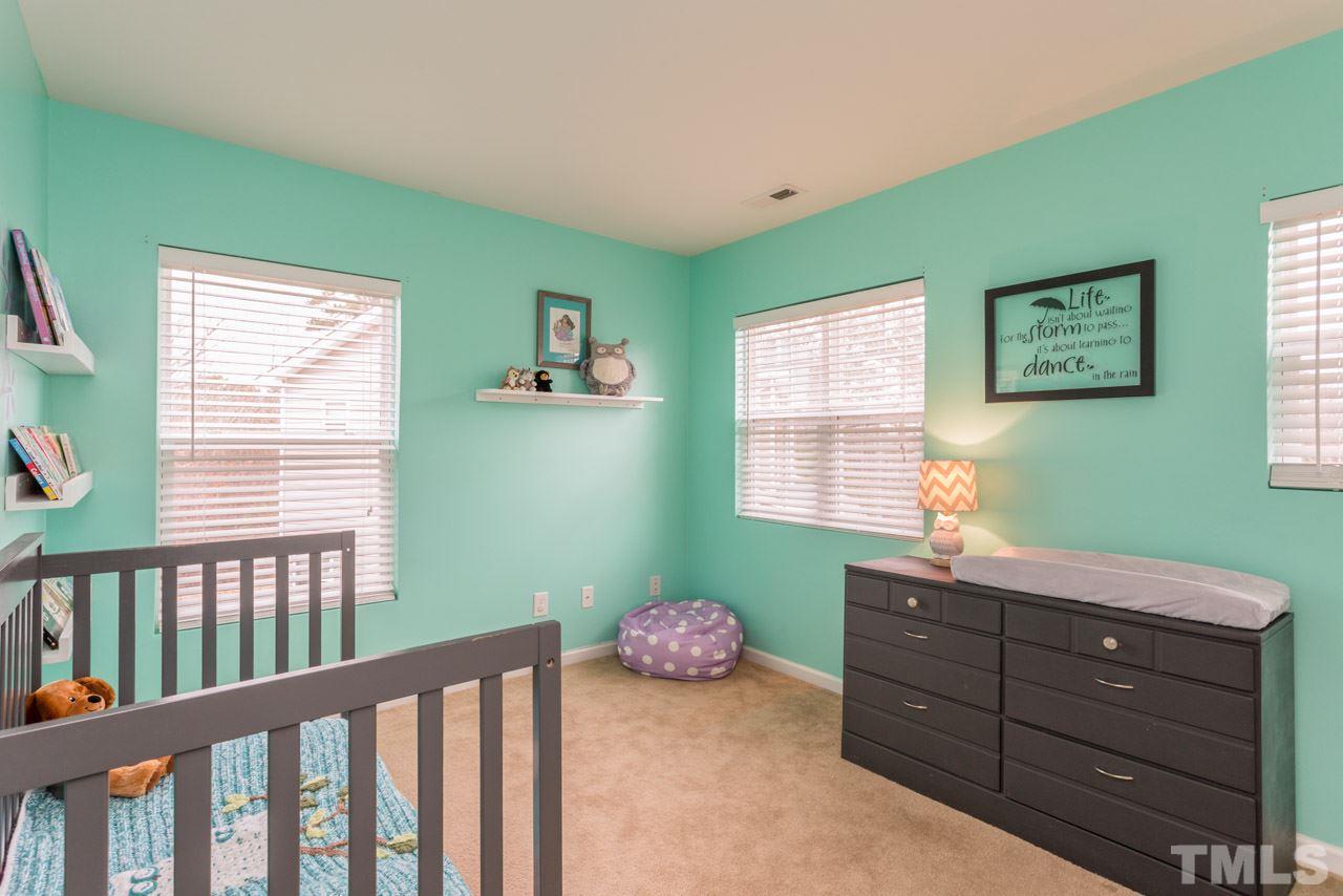 3404 Kernstown Drive Raleigh, NC 27610 - Photo 13 of 21 a bedroom with a bed and a window