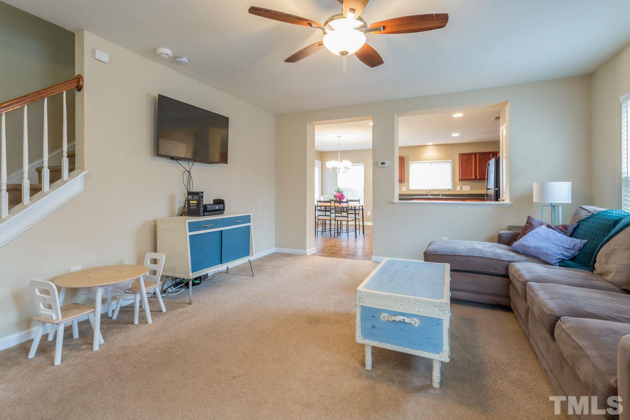 3404 Kernstown Drive Raleigh, NC 27610 - Photo 19 of 21 a living room with furniture and a flat screen tv