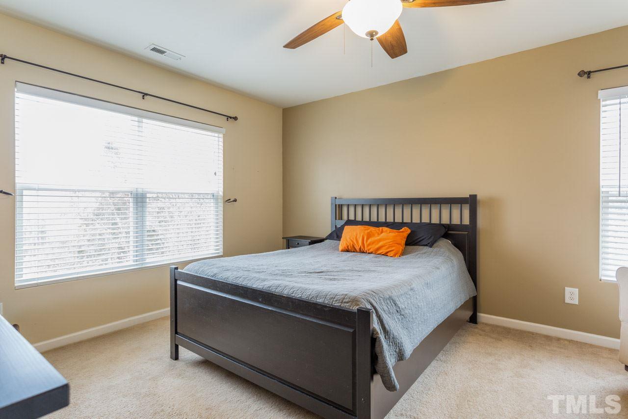 3404 Kernstown Drive Raleigh, NC 27610 - Photo 10 of 21 a bedroom with a bed and window