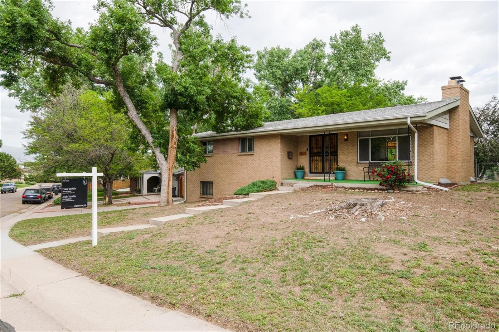 8633 West 44th Place Wheat Ridge, CO 80033 - Photo 2 of 30 a view of a house with backyard and trees