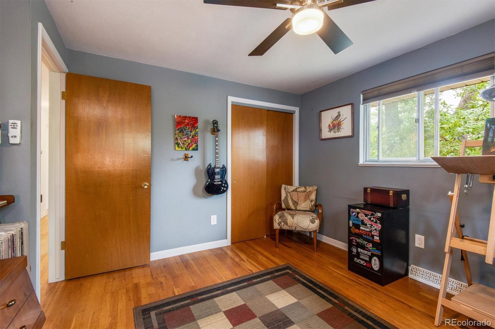 8633 West 44th Place Wheat Ridge, CO 80033 - Photo 21 of 30 a bedroom with furniture and a window