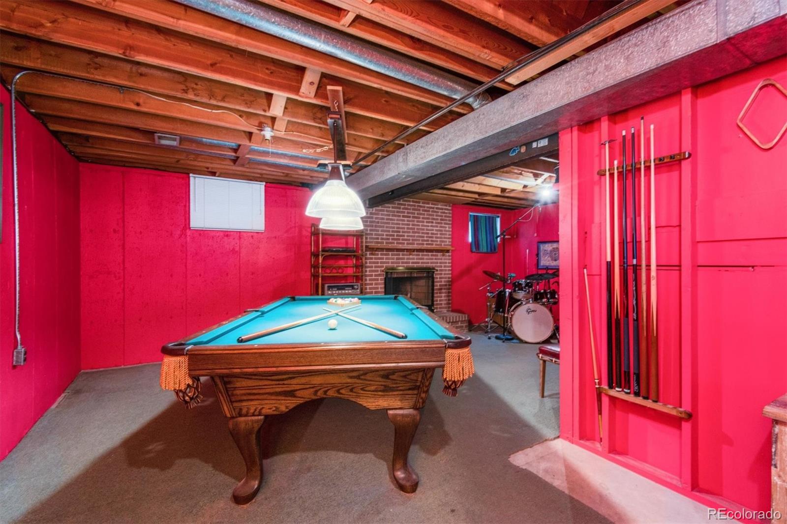 8633 West 44th Place Wheat Ridge, CO 80033 - Photo 22 of 30 a room with musical instruments