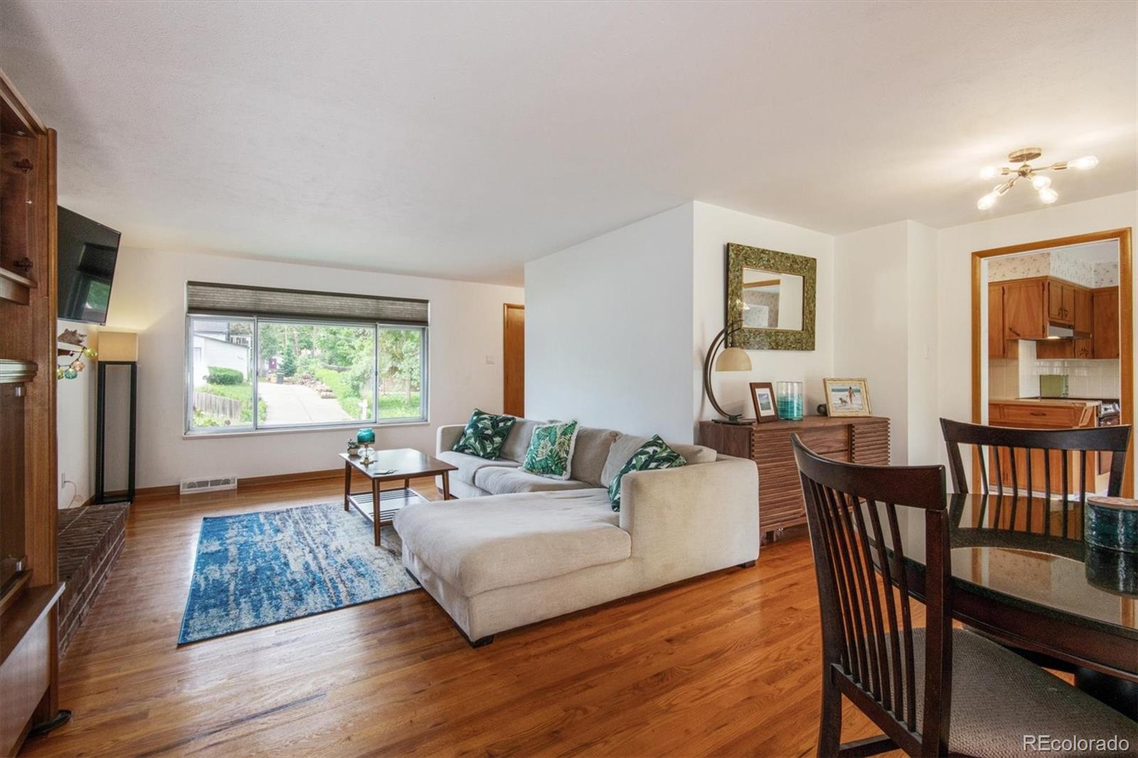 8633 West 44th Place Wheat Ridge, CO 80033 - Photo 6 of 30 a living room with furniture and a window