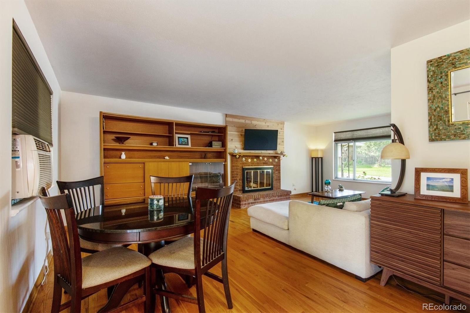 8633 West 44th Place Wheat Ridge, CO 80033 - Photo 7 of 30 a view of a dining room with furniture and window