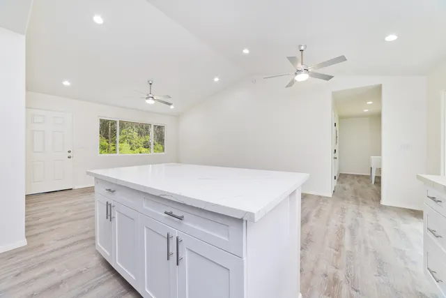 a view of a kitchen with wooden floor