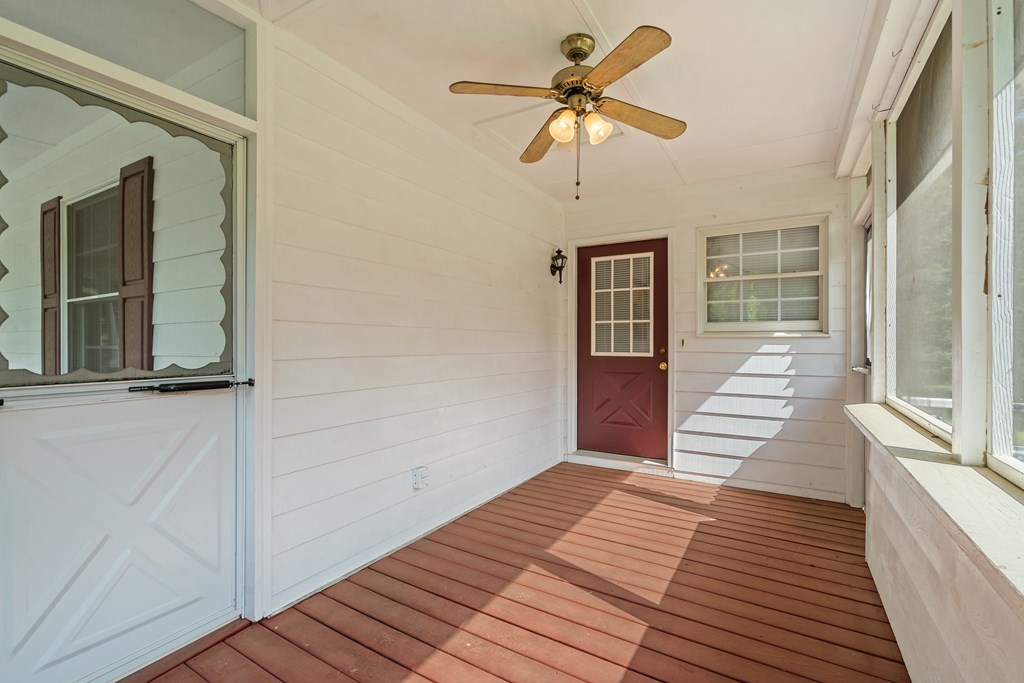 2421 Settlers Ridge Road Hiawassee, GA 30546 - Photo 13 of 46 a view of a livingroom with wooden floor and a ceiling fan