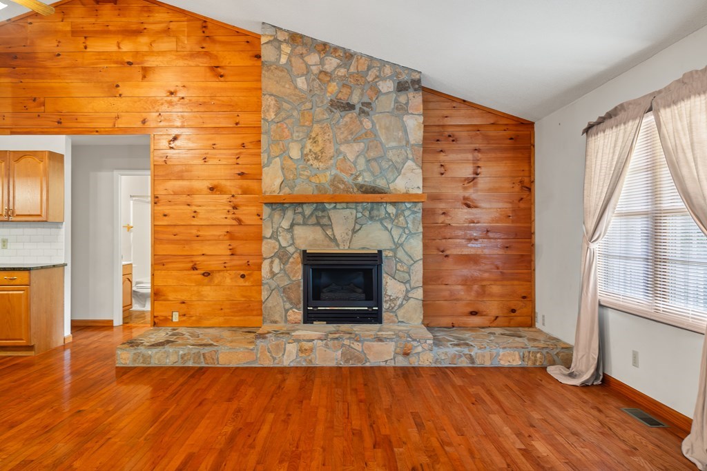 2421 Settlers Ridge Road Hiawassee, GA 30546 - Photo 16 of 46 a view of a livingroom with wooden floor and a fireplace