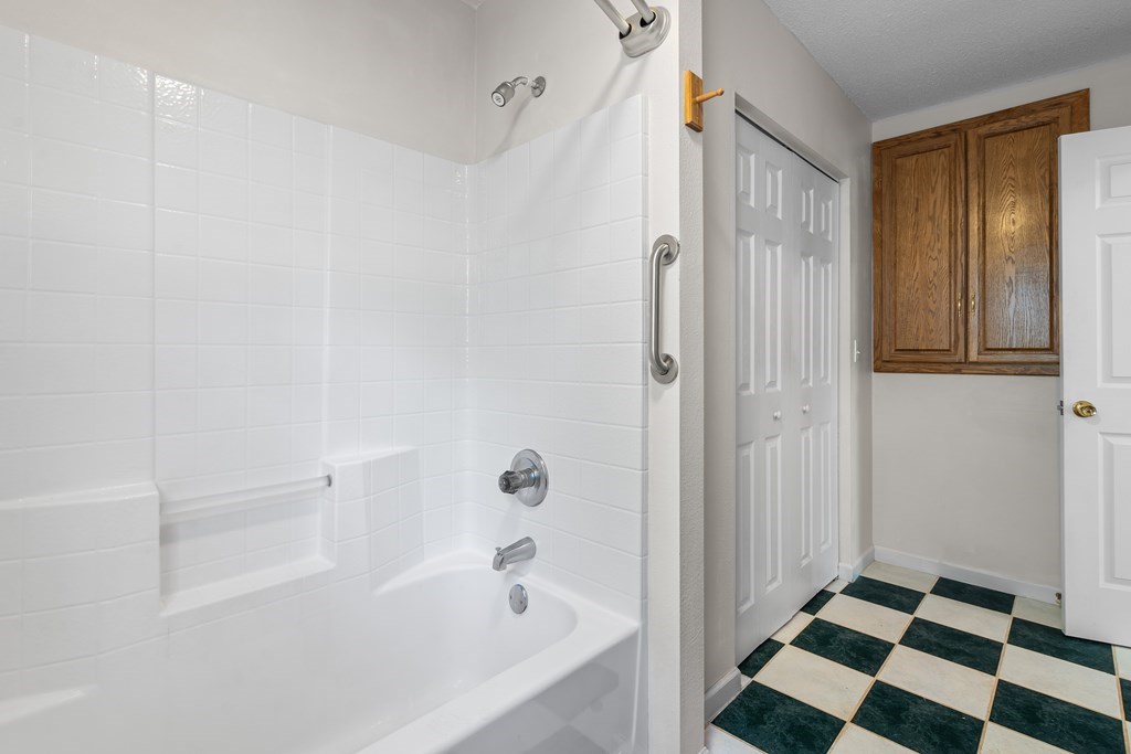 2421 Settlers Ridge Road Hiawassee, GA 30546 - Photo 34 of 46 a bathroom with a bathtub and a shower